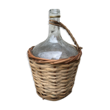 Bottle in clear glass with wicker