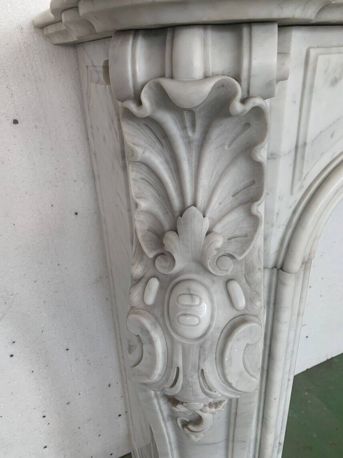 Louis XV style fireplace in white Carrara marble 19th century