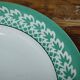 Set of 4 KIFO L'Amandinoise flat plates with green leaf design.