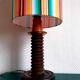 Wooden lamp with striped lampshade