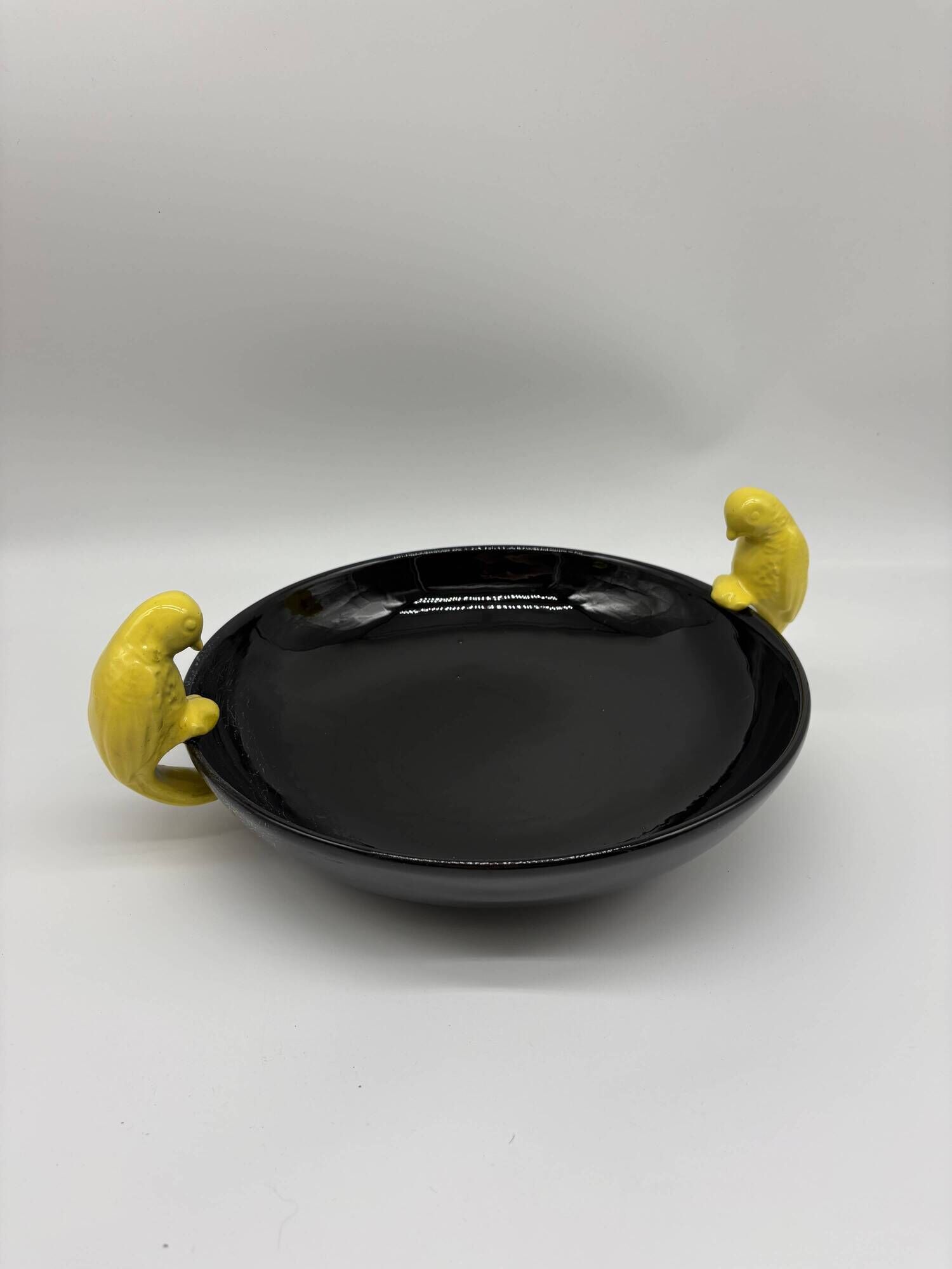Large vintage black ceramic bowl with yellow parakeets, Vallauris.