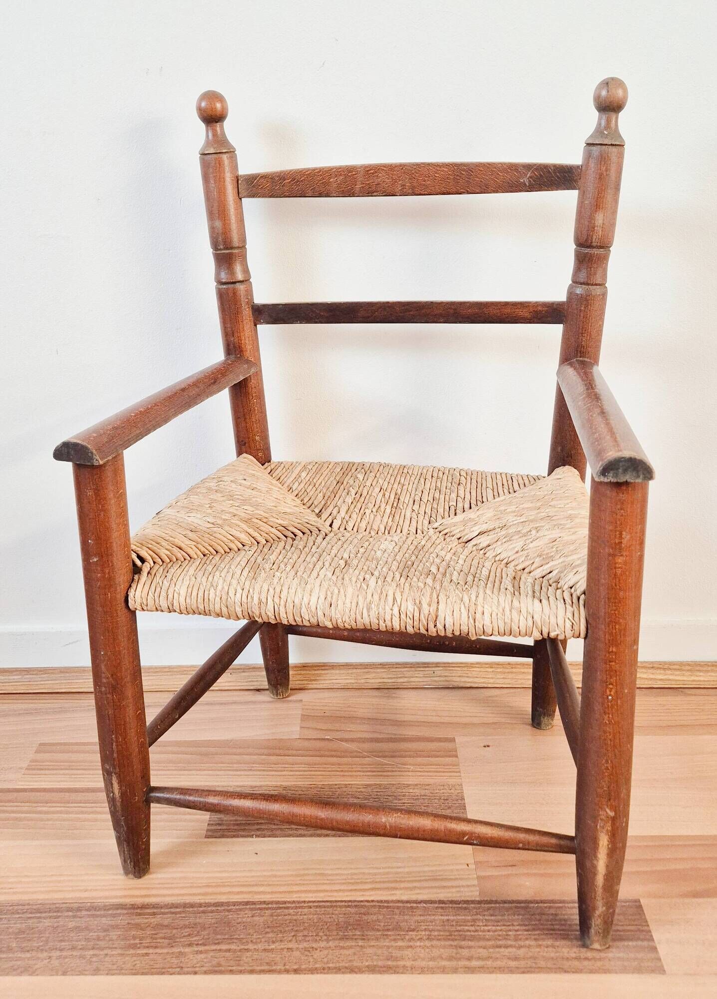 Vintage wooden and straw children's armchair, 1950s.