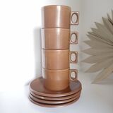 Stoneware coffee cups and saucers