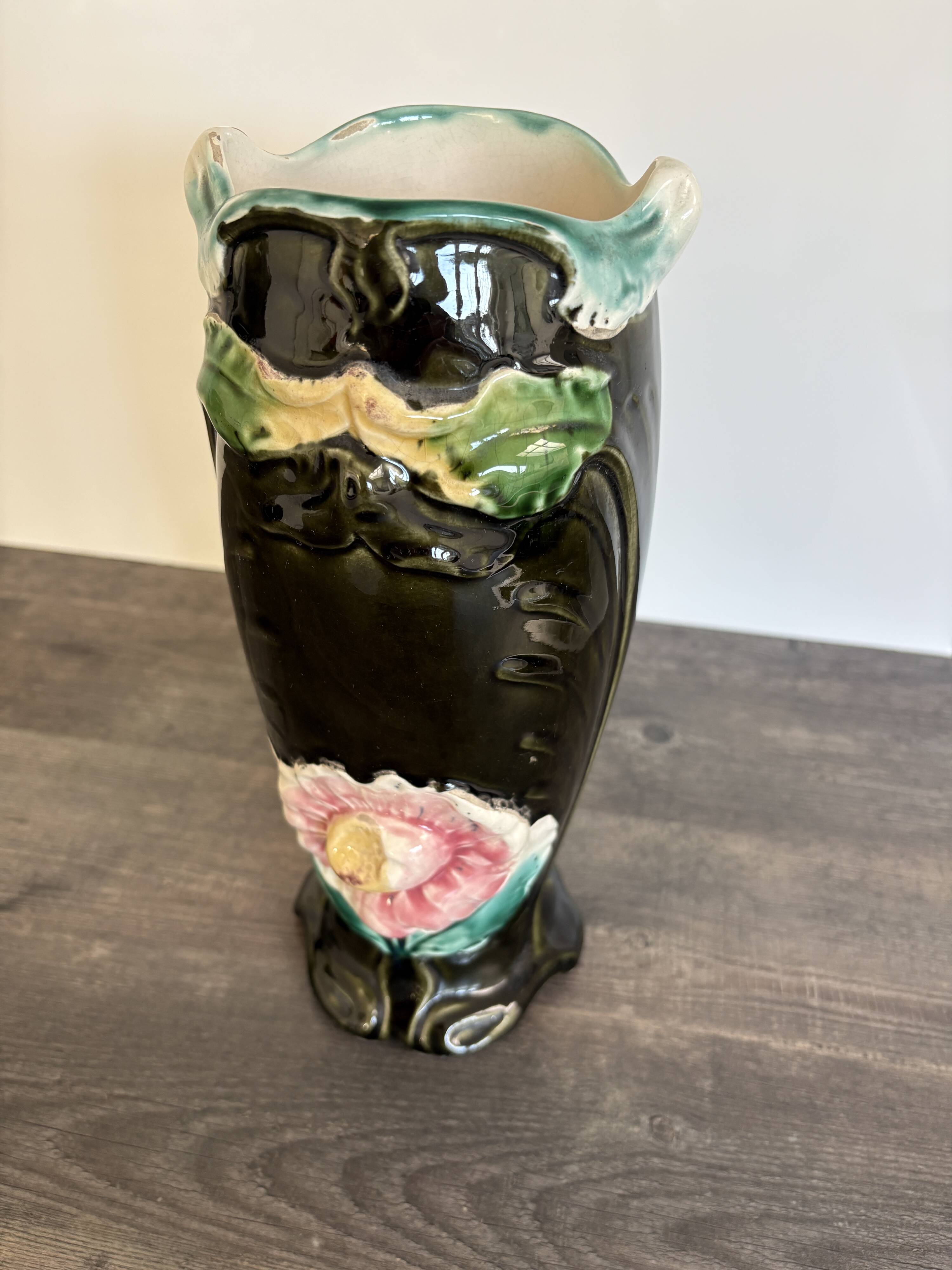 Antique ceramic vase by De Bruyn with floral decoration.