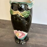 Antique ceramic vase by De Bruyn with floral decoration.