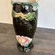 Antique ceramic vase by De Bruyn with floral decoration.