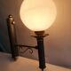 Empire style torch wall sconce