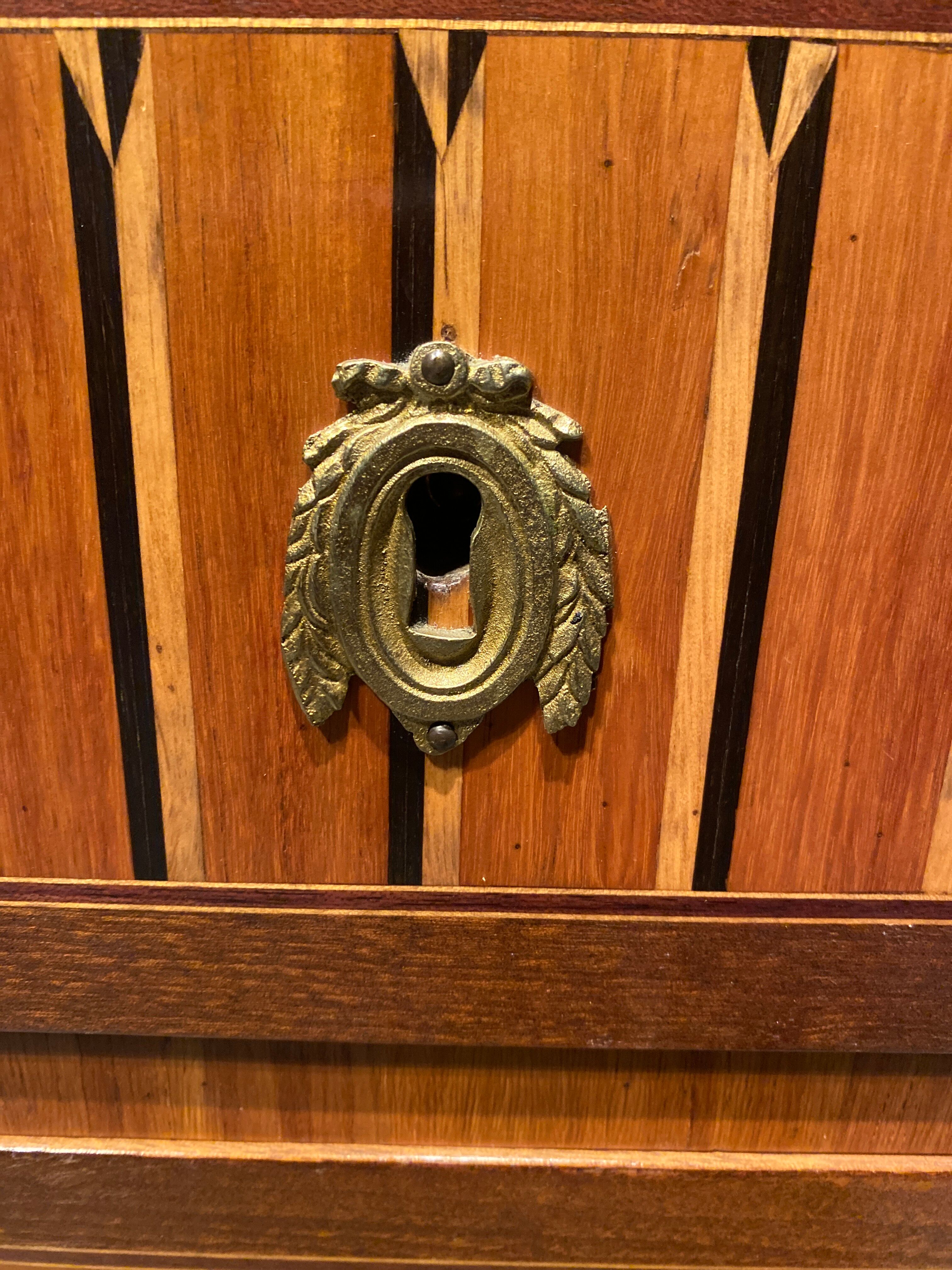 Inlaid chest of drawers with marble top