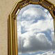 Vertical mirror, gold frame with beading.