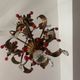 Antique chandelier in gilded sheet metal and red and white crystal pendants, 1900