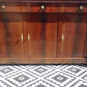 Flamed mahogany enfilade with sea green marble in Empire style.