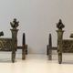 Pair of Empire Period Chenets in Chiselled Bronze with Torches and Leaf Frieze