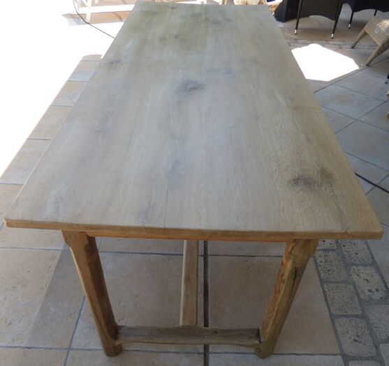 Large honey-colored farmhouse table in solid oak