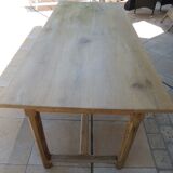 Large honey-colored farmhouse table in solid oak