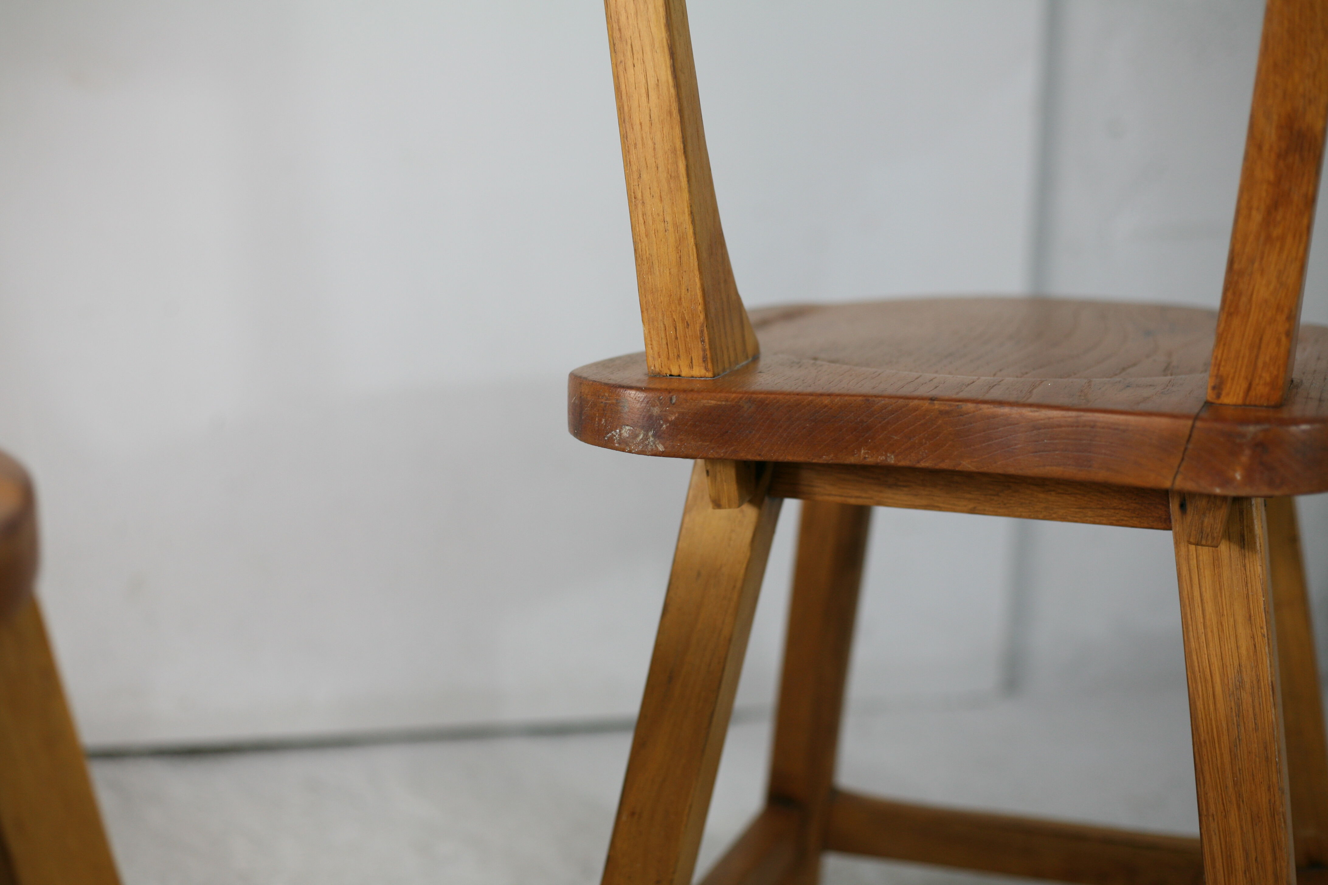 Pair of brutalist wooden back stools. France, circa 1960