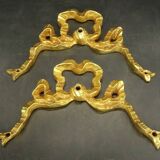 Pair of pediments with Louis XVI style knot in gilded bronze