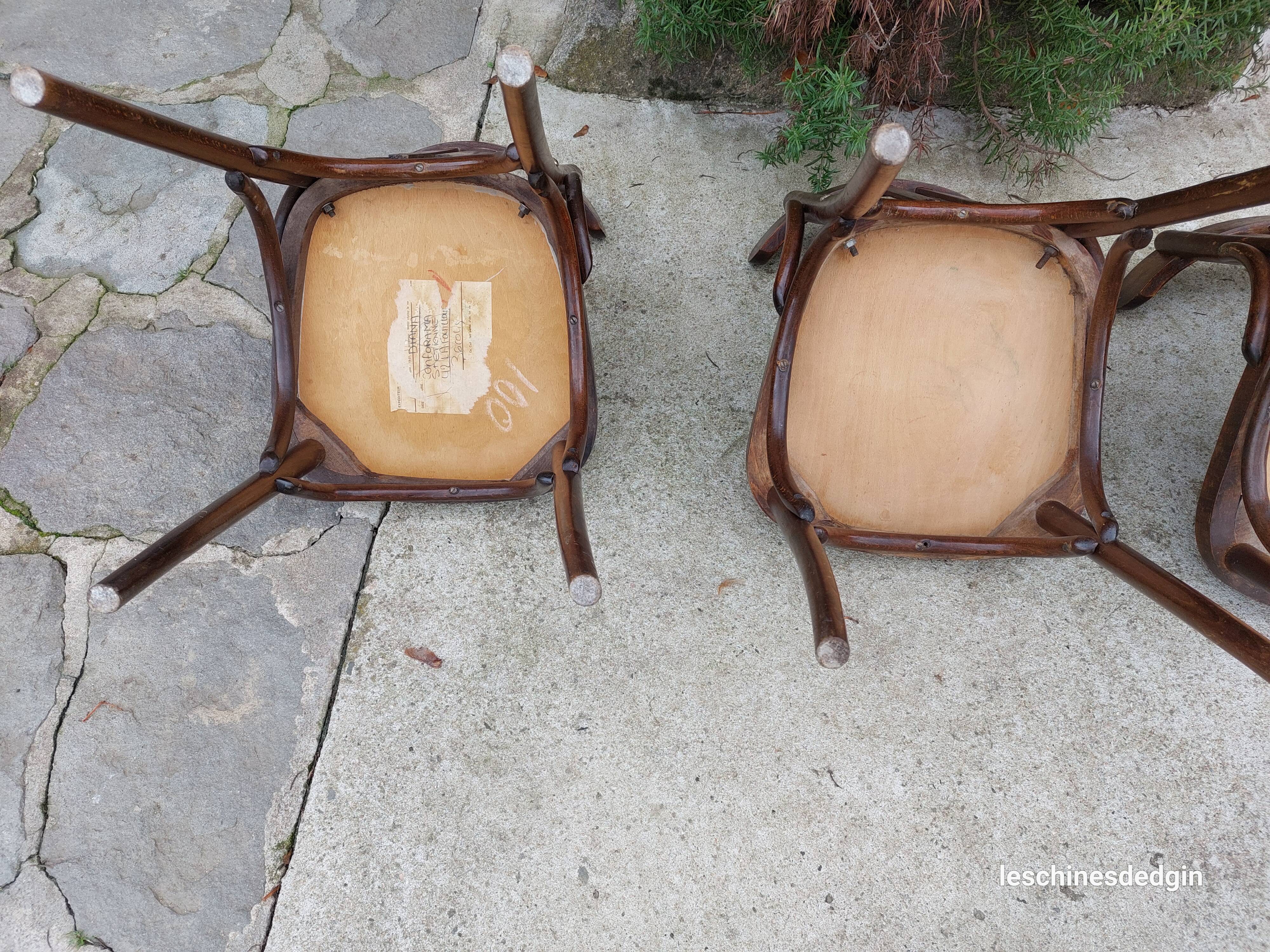4 bentwood bistro chairs with a pattern on the seat