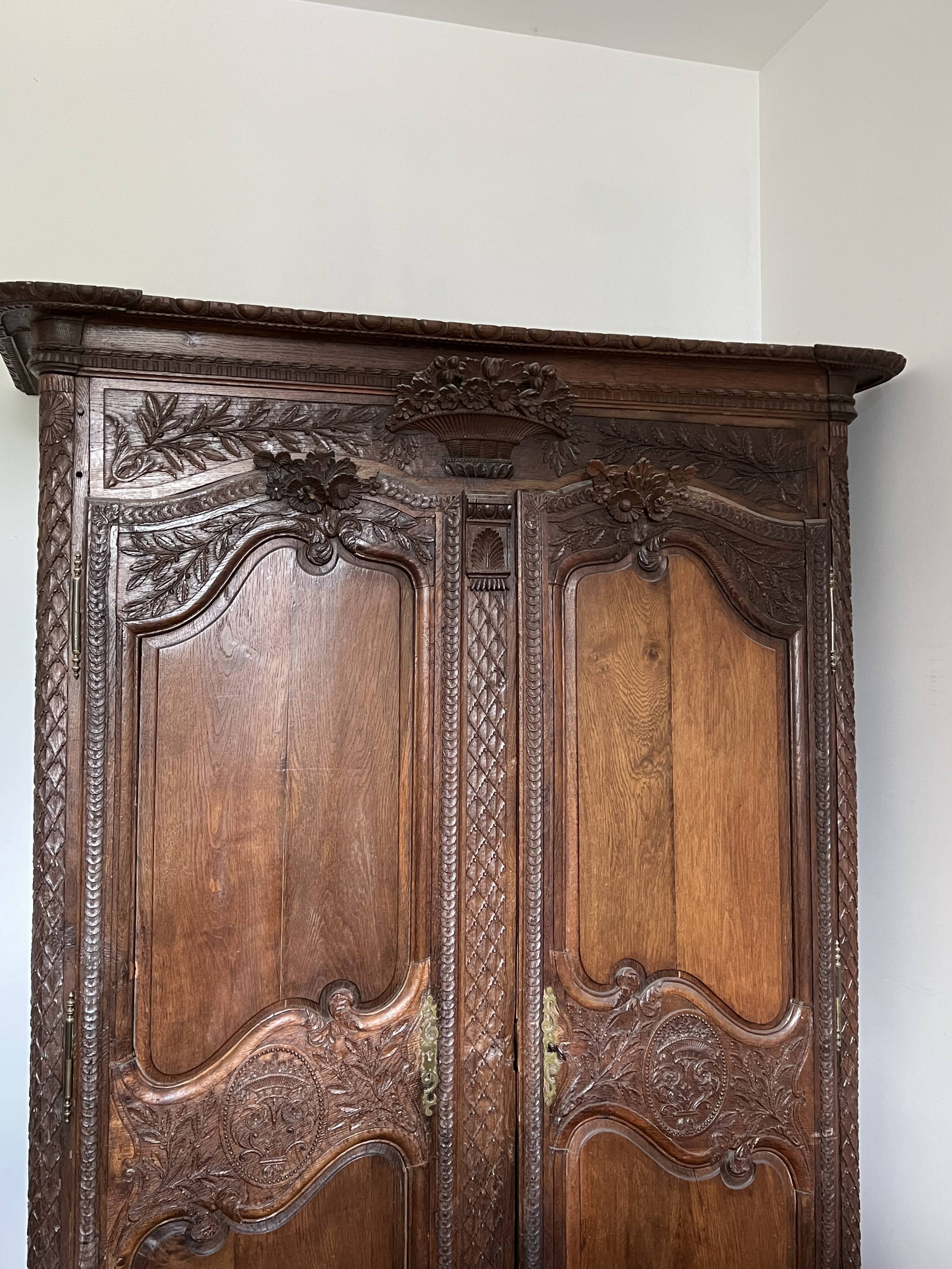 Beautiful and ancient Norman wedding wardrobe, richly carved