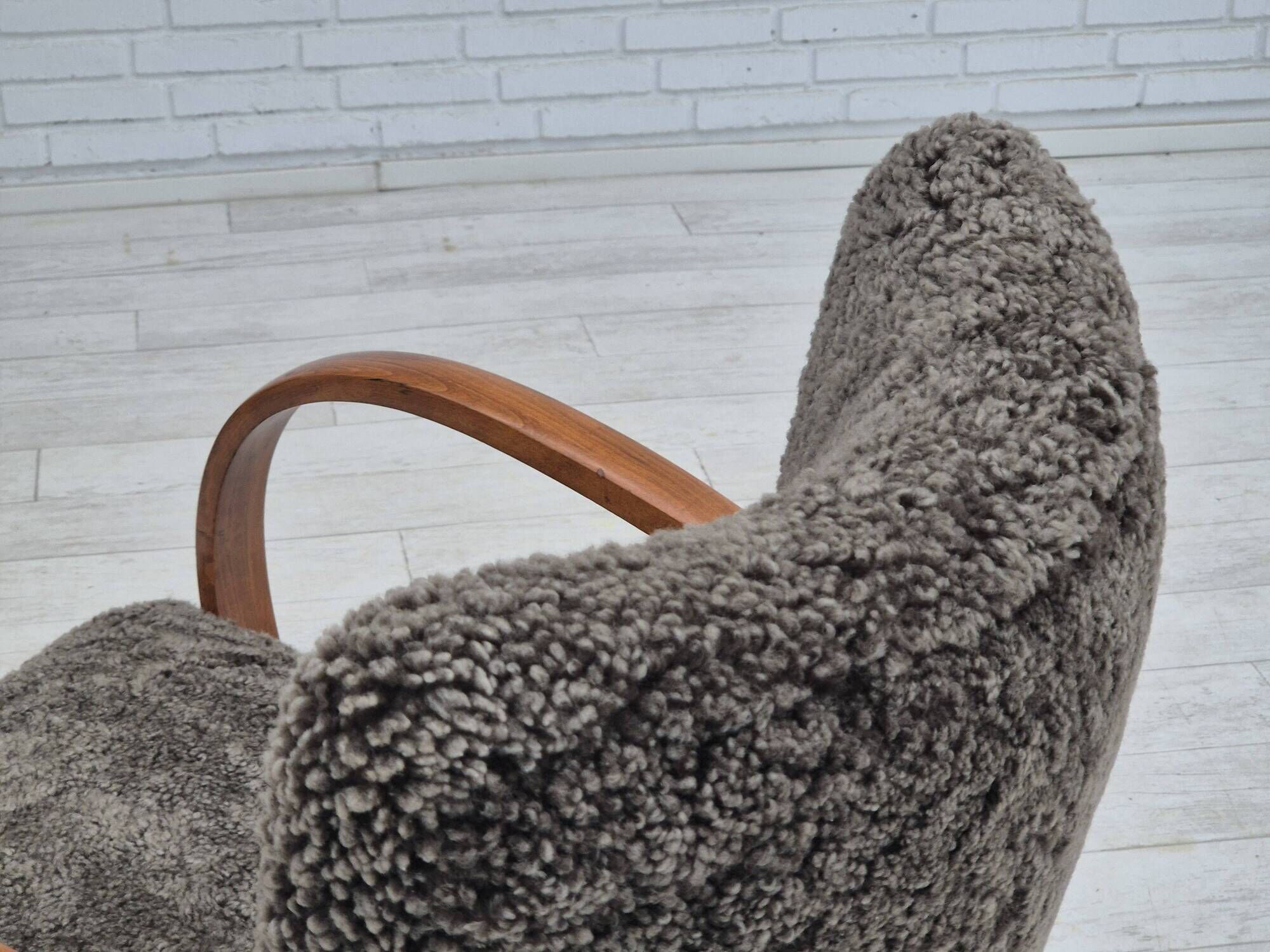 1960s, completely reupholstered Danish art deco armchair, genuine sheepskin "Wellington".