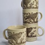 Set of four mugs in enamelled sandstone with bird decoration, made in england