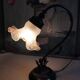 Tulip lamp in patinated black metal with an opaque glass shade.