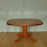 Oval walnut table with extension cords