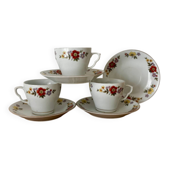 Vintage set of 3 cups and 4 saucers with floral pattern.