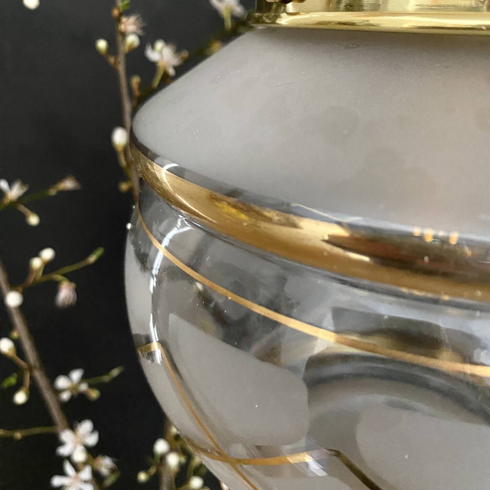 Vintage art deco globe pendant light in white and gold frosted glass