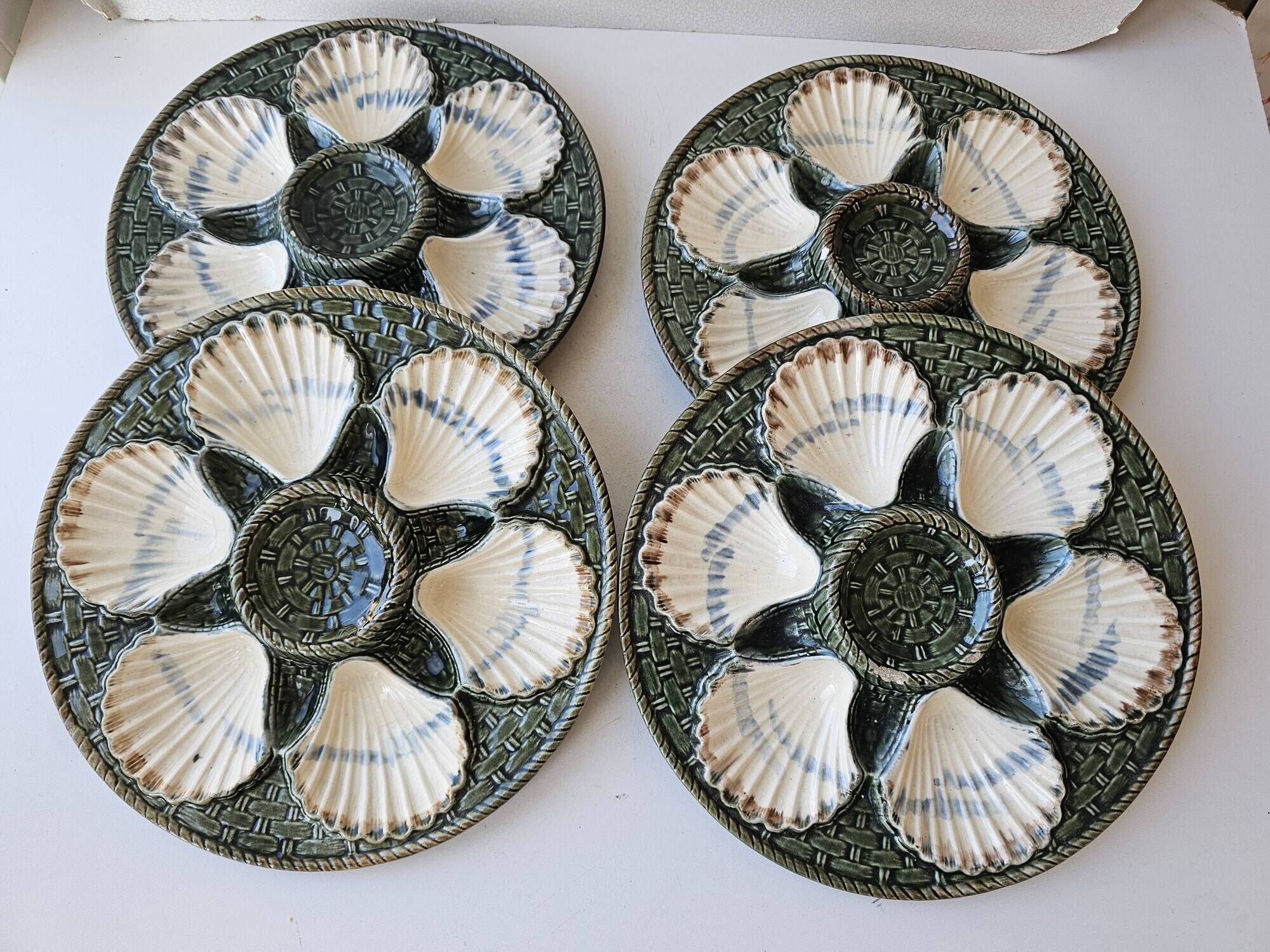 Set of 4 vintage green and white majolica oyster plates.