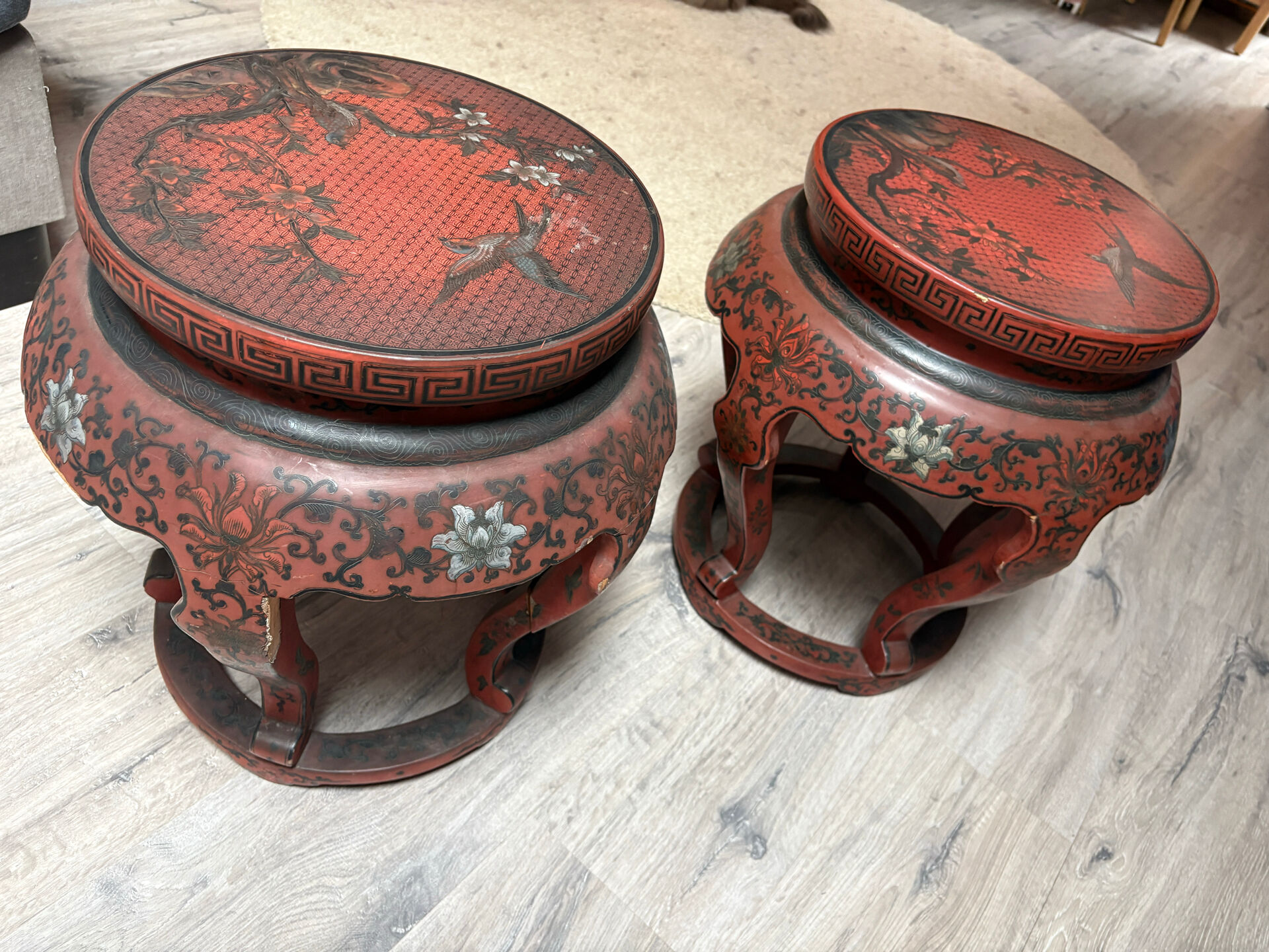 Pair of stools / Chinese side tables in red lacquered wood