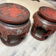 Pair of stools / Chinese side tables in red lacquered wood