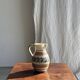 Beige carafe with stylized blue flower friezes