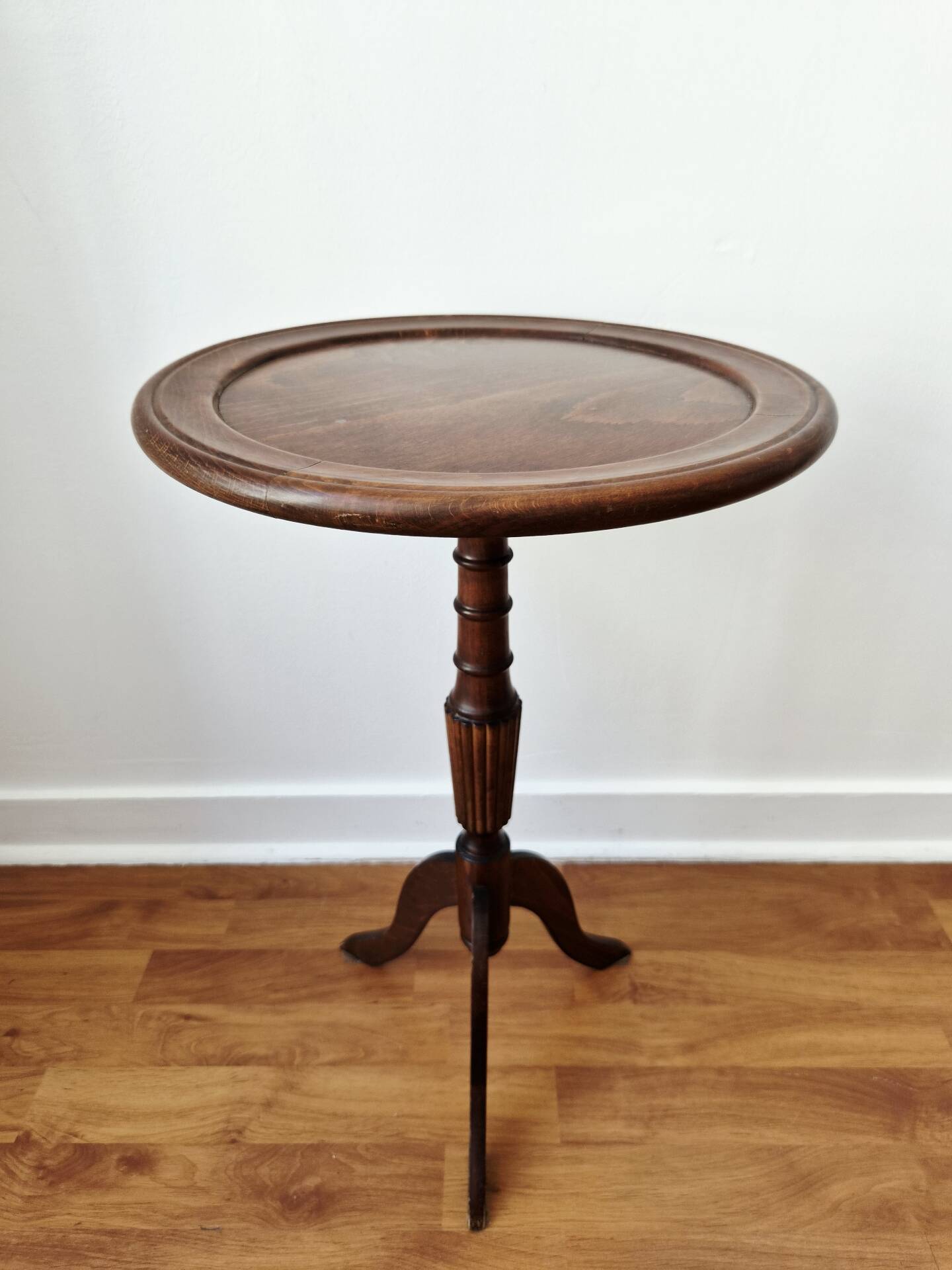 Small tripod wooden table with a vintage round top -