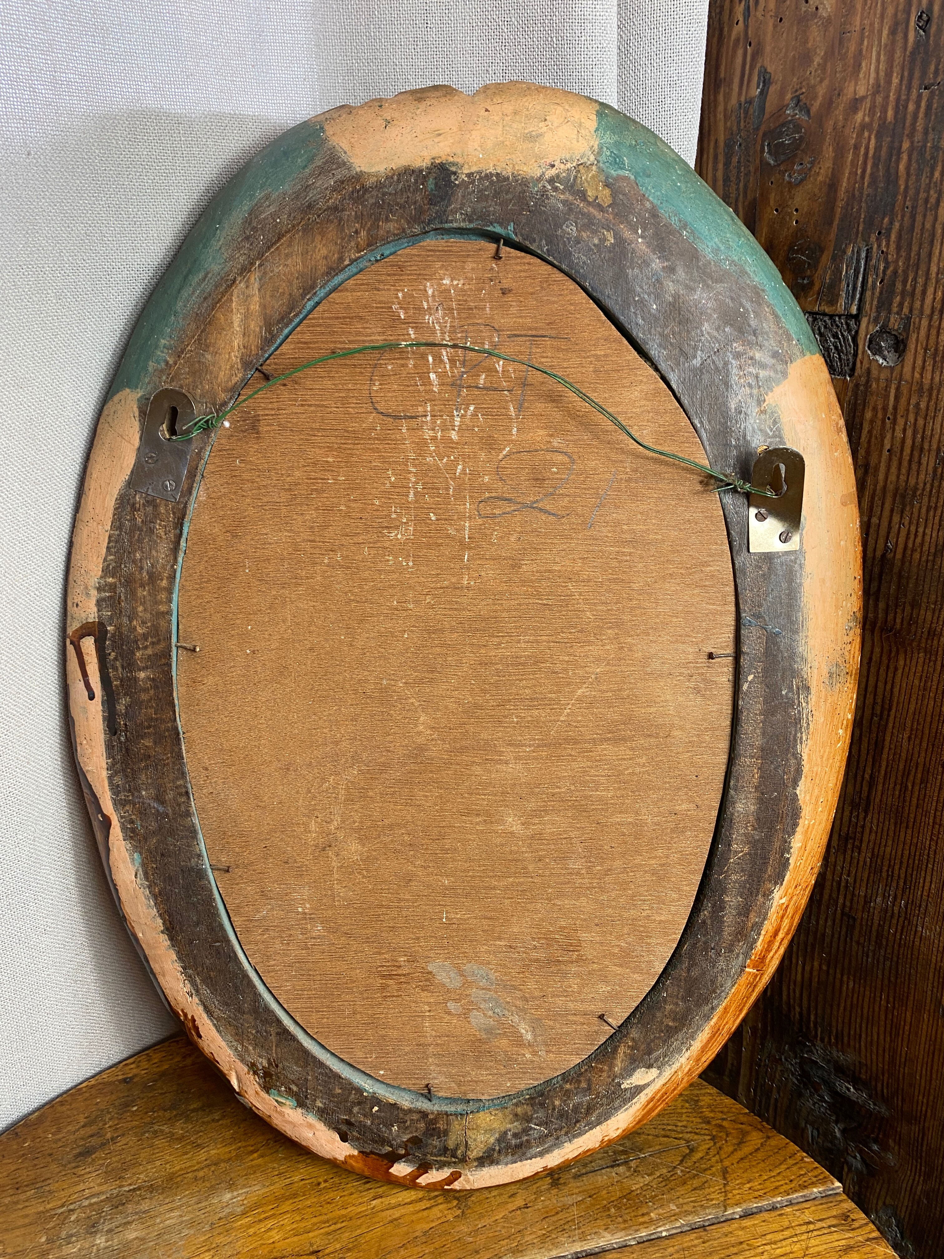 Oval mirror in carved wood