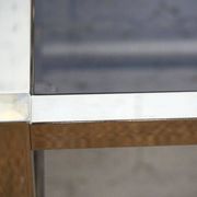 Gold chrome coffee table with double smoked glass tops 1970s