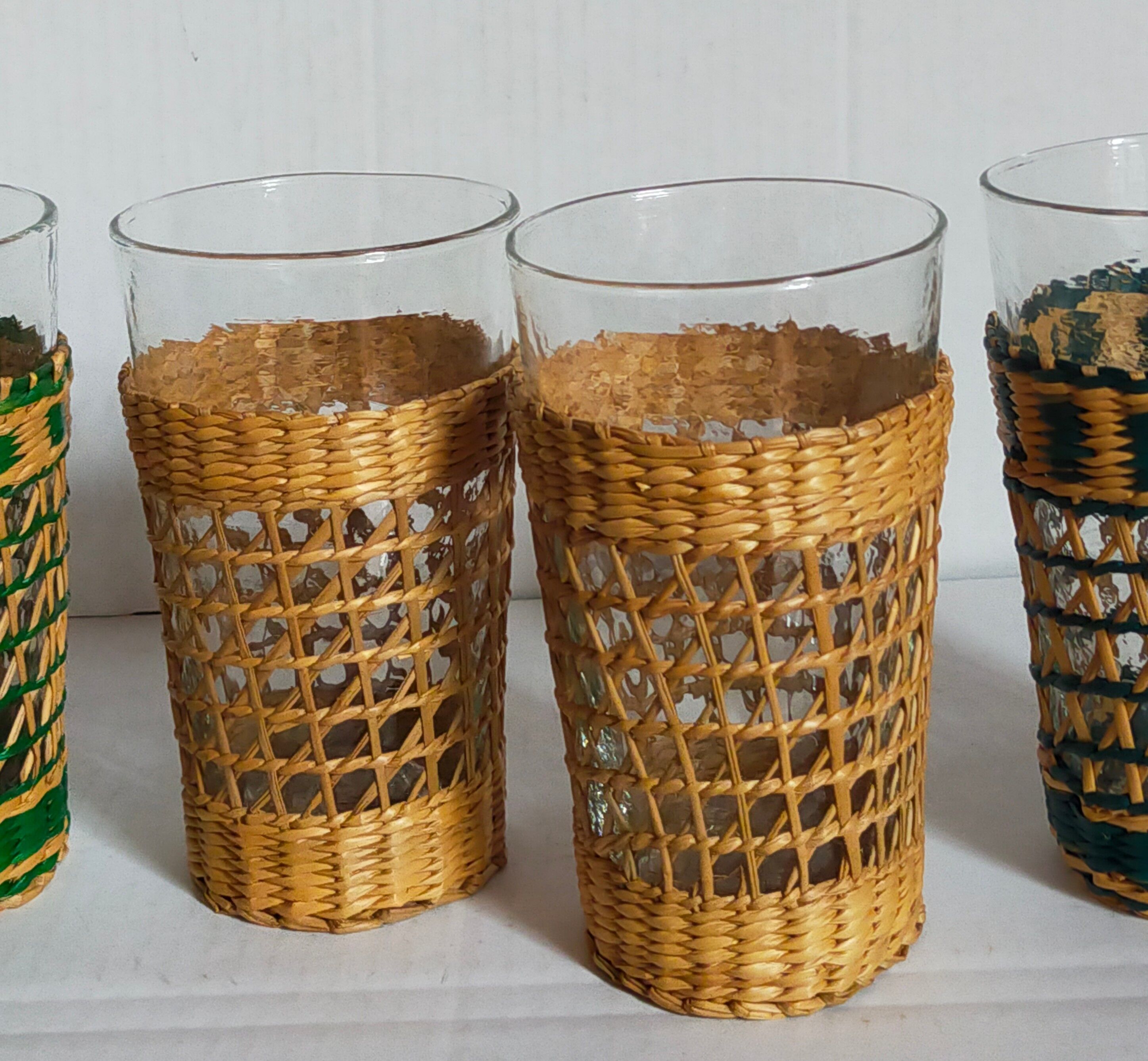 Four long drink glasses in vintage woven rattan cases