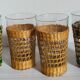 Four long drink glasses in vintage woven rattan cases