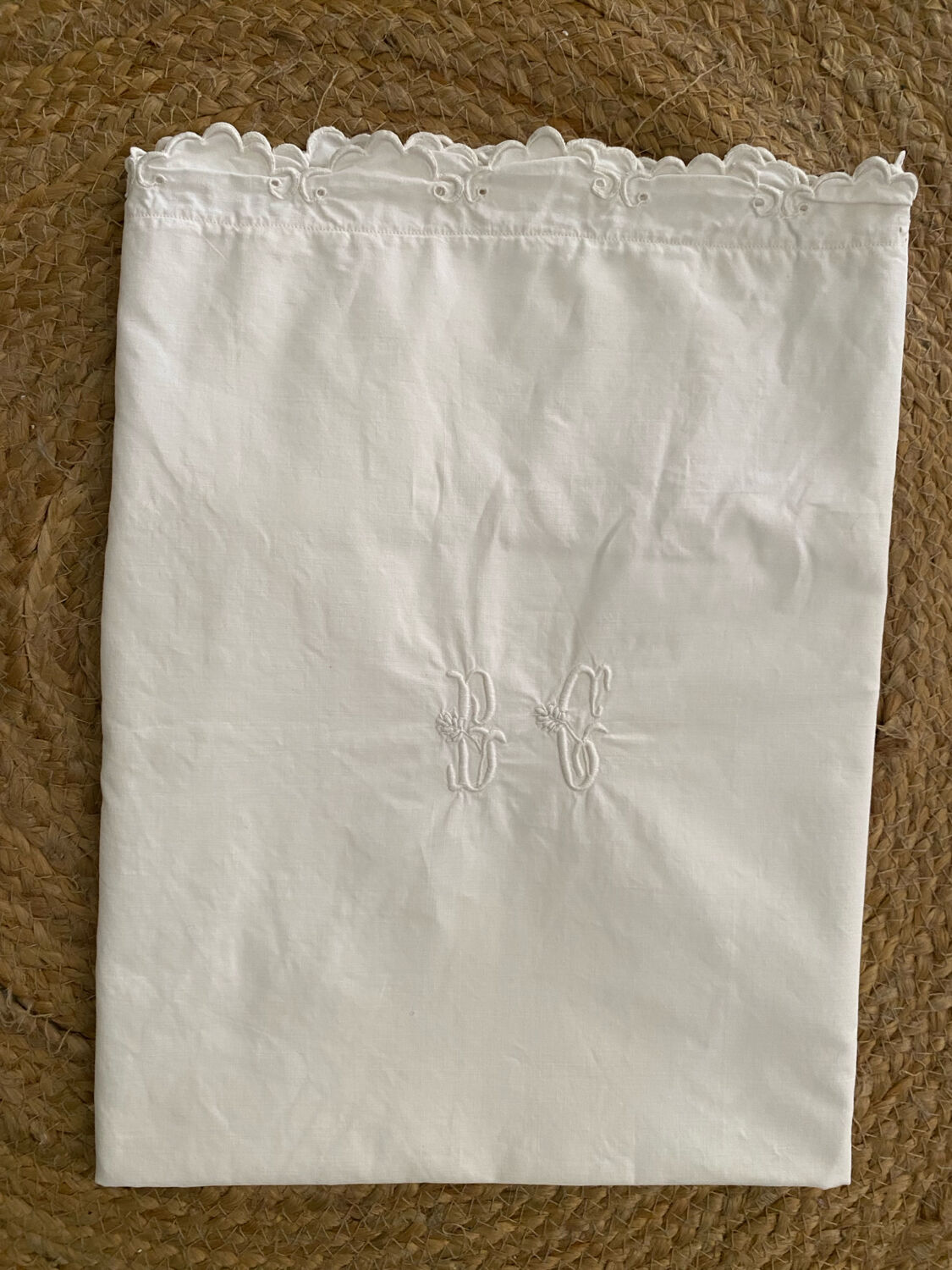 White cotton pillowcase with monogram BC.