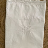 White cotton pillowcase with monogram BC.