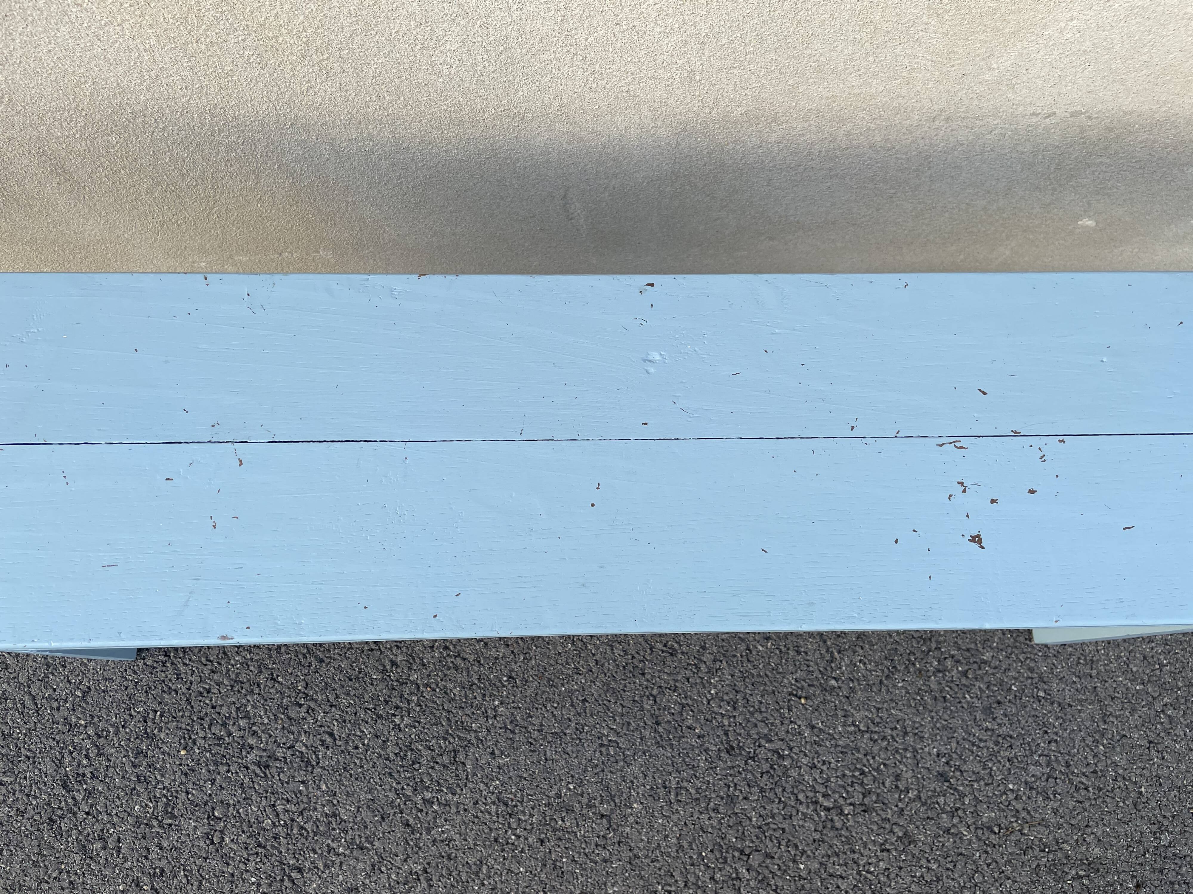 Blue painted wooden bench