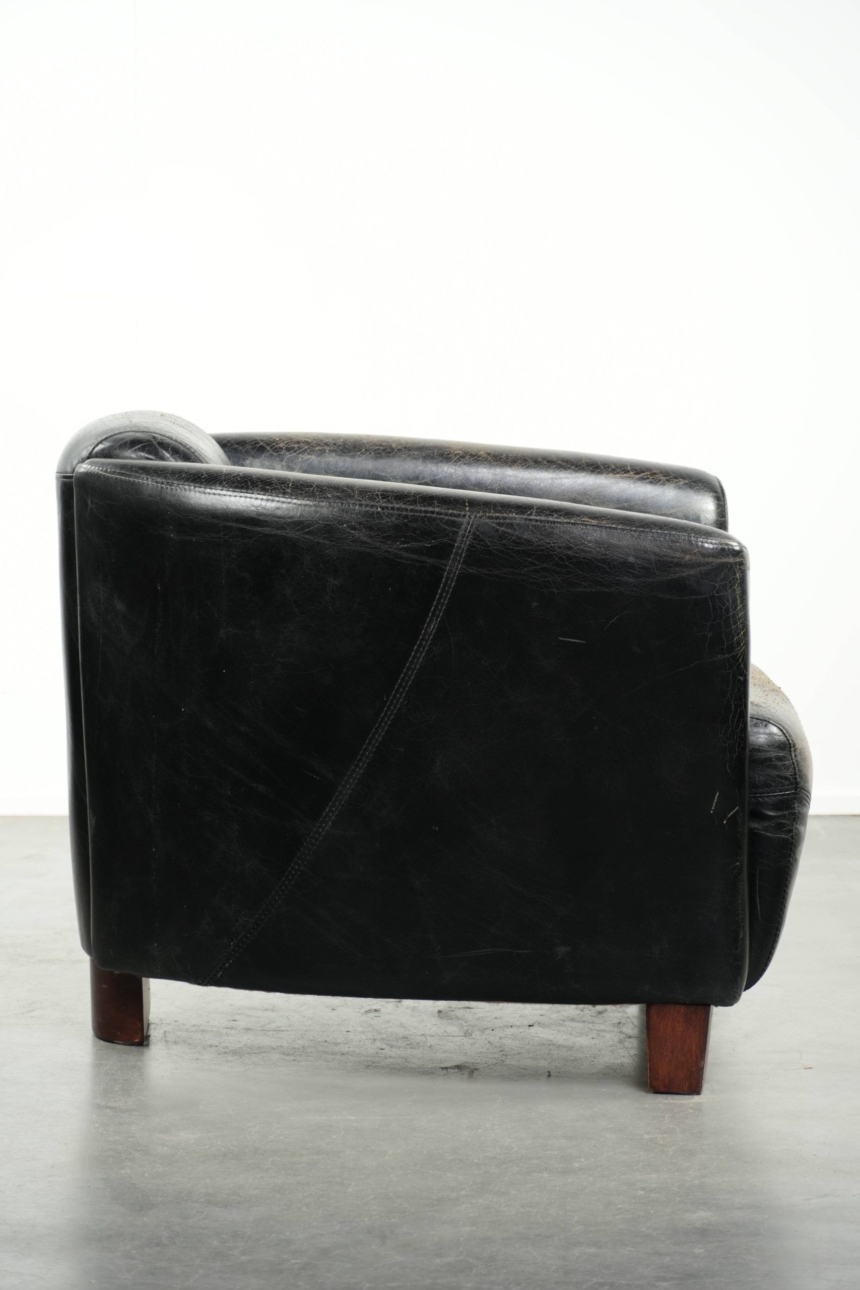 Black vintage cowhide aviator design armchair with characterful appearance