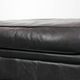 Large and timeless black ottoman made of cowhide leather in English style