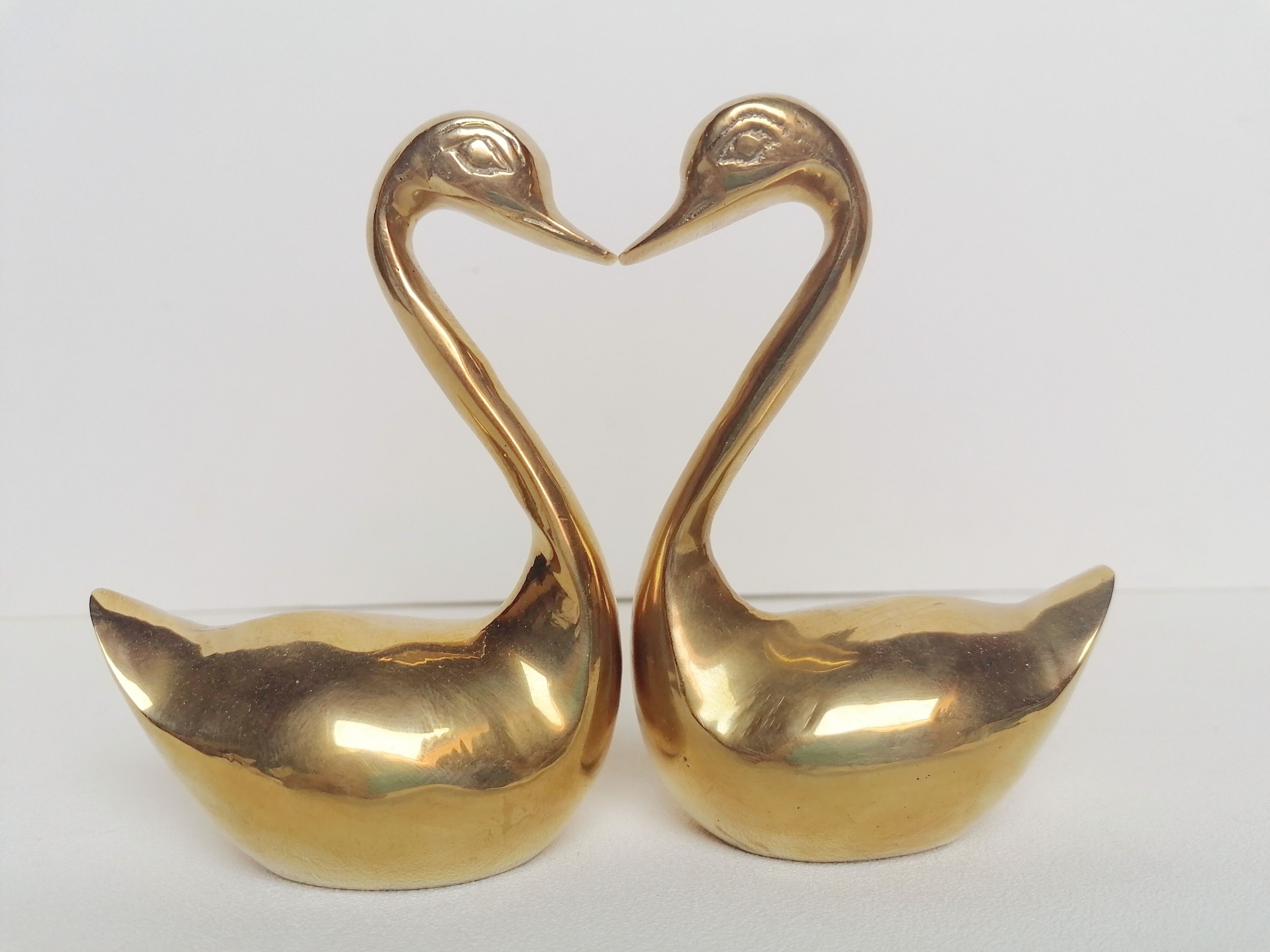 Two ducks made of solid brass