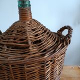 Dame Jeanne in her wicker and rattan clothing