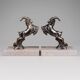 Art Deco bookends with patinated ibex in a taupe marble base.