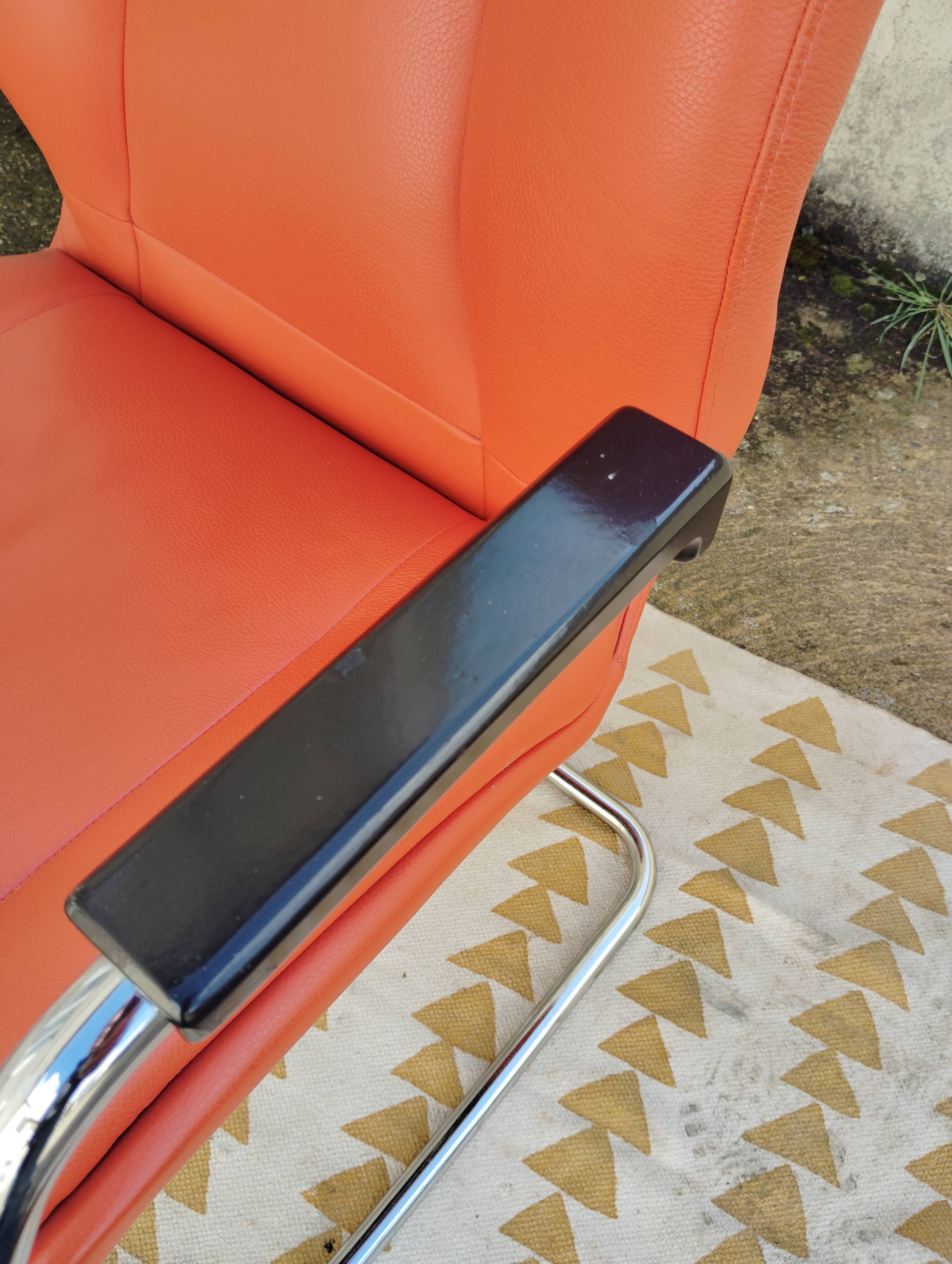 Orange leather cantilever tubular armchair