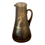 Vintage smoked glass carafe with gold from the 50s/60s, featuring a marine and water skiing design.