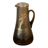 Vintage smoked glass carafe with gold from the 50s/60s, featuring a marine and water skiing design.