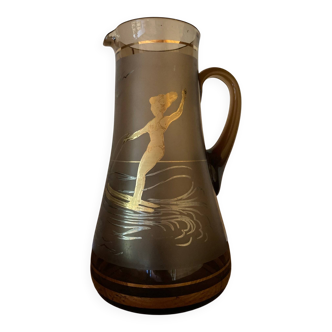Vintage smoked glass carafe with gold from the 50s/60s, featuring a marine and water skiing design.