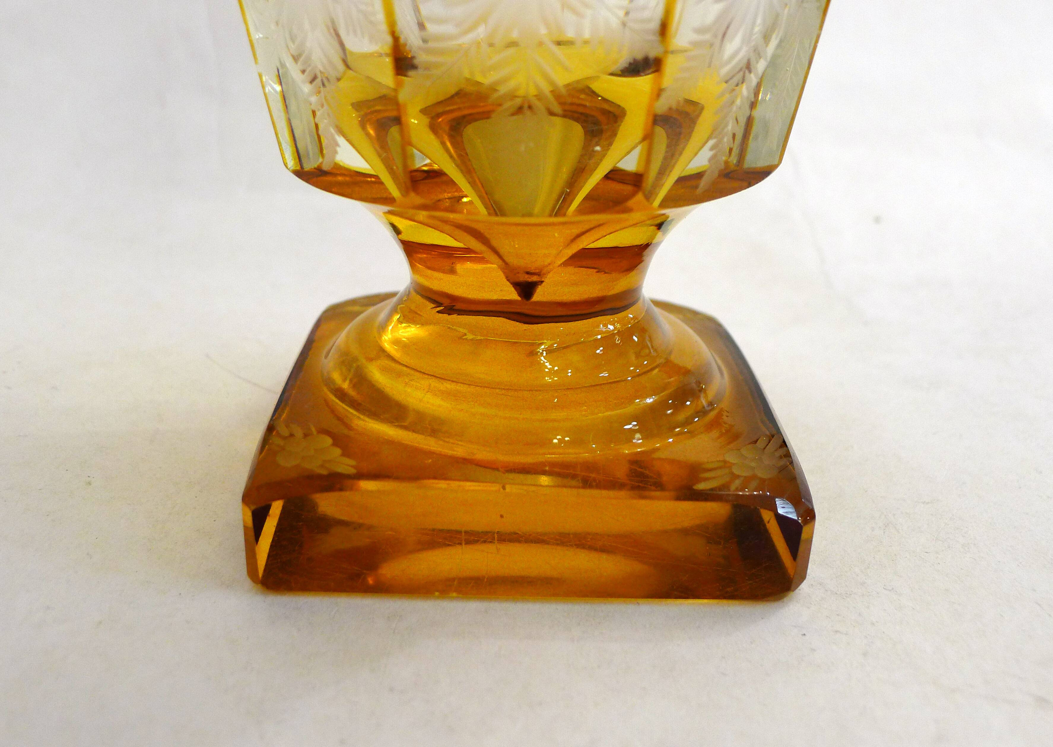 Art Deco vase engraved with flowers, faceted body on a pedestal.